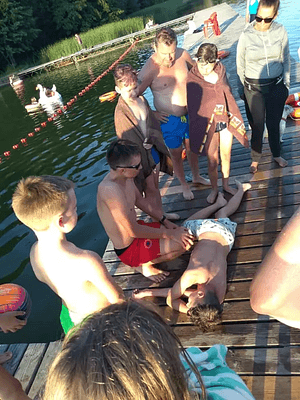 Children on a jetty during the first-aid field game