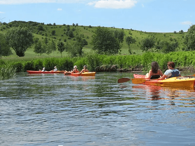 Paddlers kayaking down the Drwęca River